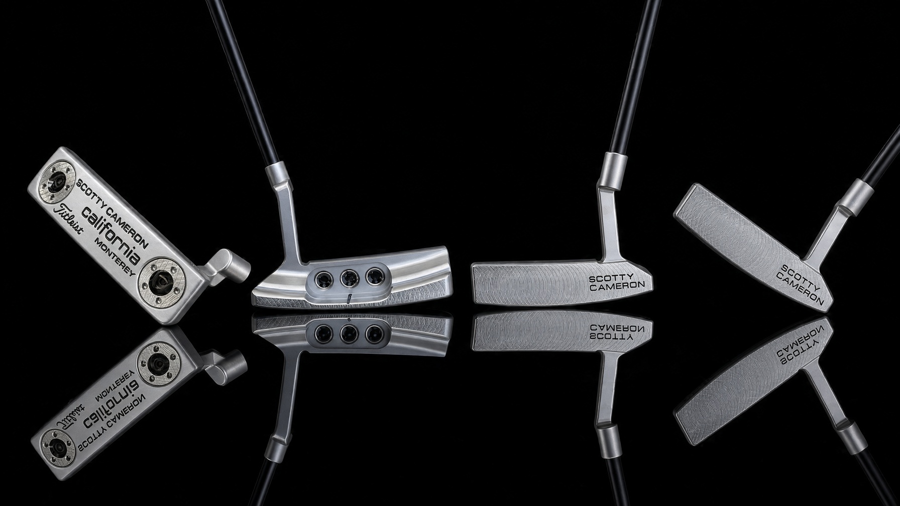 Four restored Scotty Cameron putters on a reflective black surface