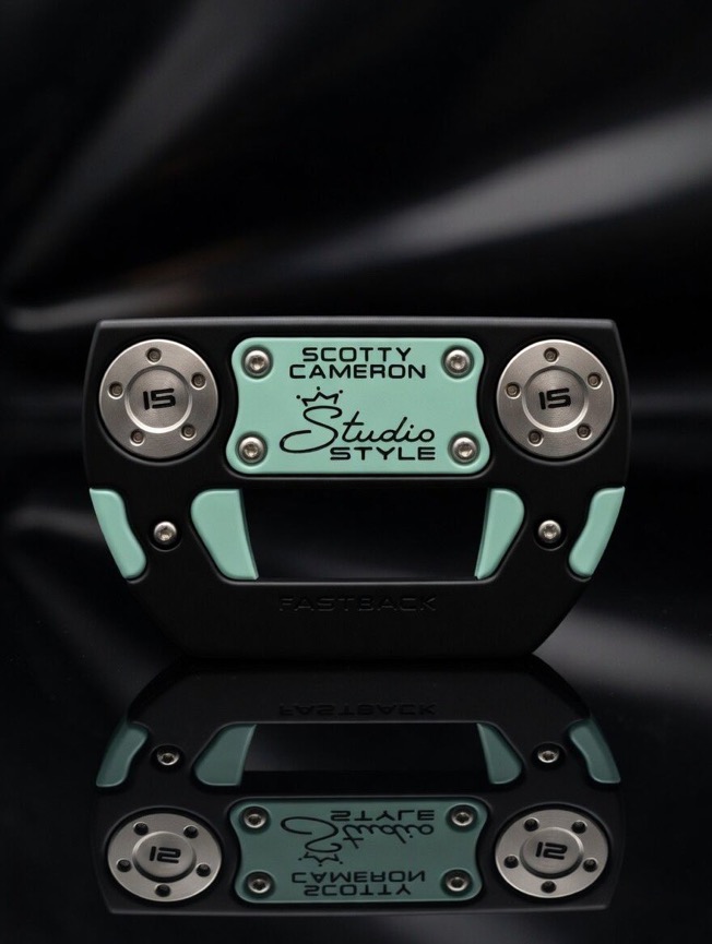 Black Scotty Cameron Fastback sole with seafoam blue inlays and stamped steel weights